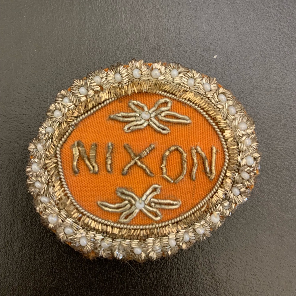 Nixon embroidered pin